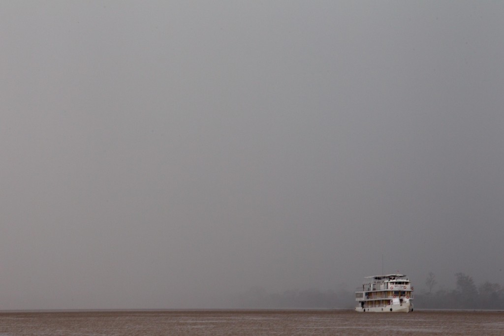A boat travels down the mighty Amazon amidst a rain storm. Photo By Shannon (Switzer) Swanson