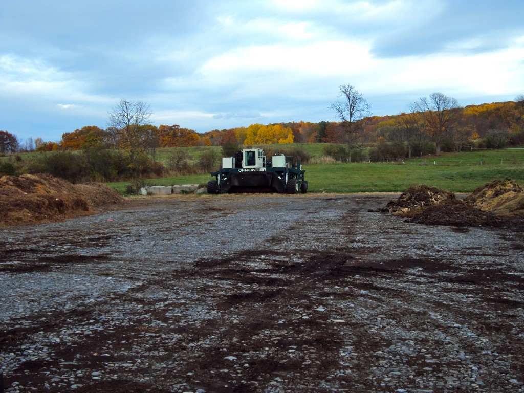 A windrow turner to mix and aerate the piles.