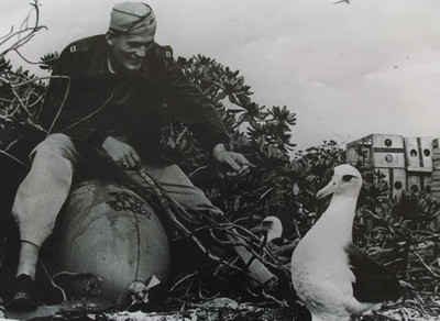 US soldier and Laysan albatross having a moment 