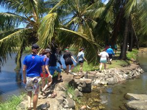 The class takes a tour of the pond. (Photo courtesy of intrepid TA Courtney Pickett).