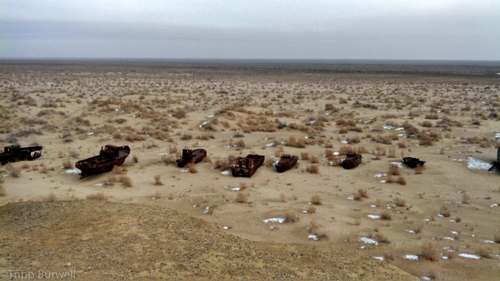 Scuttled, rusted boats on the former coastline of the Aral Sea in Moynaq, Uzbekistan, a UNESCO World Heritage Site.