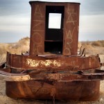 A ship with graffitti on the former lakebed.