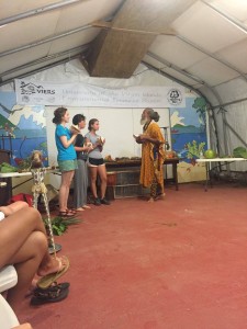 Elizabeth Anne Brown, Aurora Krom, and Madison Harman learning how to blow a conch shell! Debate on whether it's pronounced 'con-K' or 'con-CH' yet to be settled. Picture by Angela Griffe.