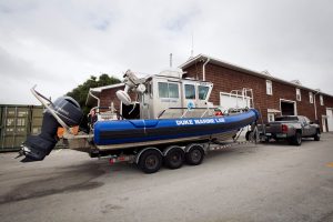 Boats at the Duke Marine Lab being pulled indoors while students and staff evacuated the coastal campus for Hurricane Matthew.